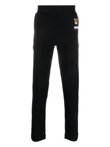 Moschino pantalon de jogging à imprimé Leo Teddy - Noir