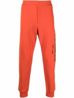 Alexander McQueen pantalon de jogging à logo imprimé - Orange - thumbnail