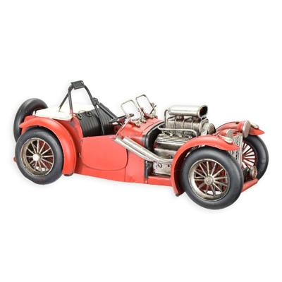 A TIN MODEL OF A CLASSIC RACE CAR