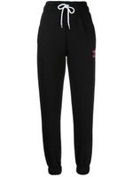 BAPY BY *A BATHING APE® pantalon de jogging à slogan brodé - Noir BAPY BY *A BATHING APE® pantalon de jogging à slogan brodé - Noir