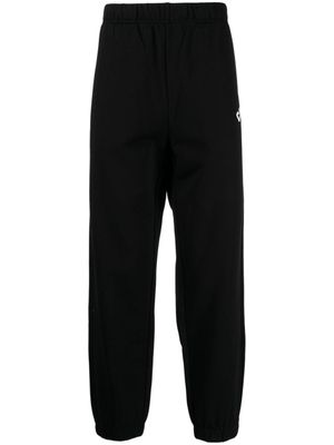 CHOCOOLATE pantalon de jogging en coton à logo imprimé - Noir