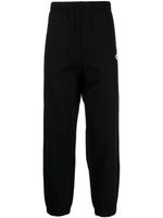 CHOCOOLATE pantalon de jogging en coton à logo imprimé - Noir