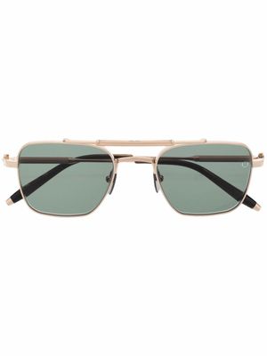 Akoni lunettes de soleil Europa à monture carrée - Or