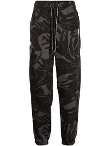 AAPE BY *A BATHING APE® pantalon fuselé à imprimé graphique - Noir