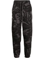 AAPE BY *A BATHING APE® pantalon fuselé à imprimé graphique - Noir