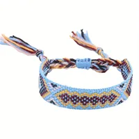 Handgemaakte geweven verstelbare armband uit Nepal met lichtblauw-oranje-donkerrood motief - Sieraden - Spiritueelboek.nl - thumbnail