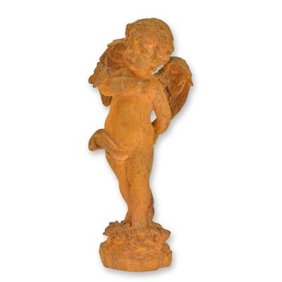 A RUSTY CAST IRON FIGURINE OF A PUTTO WITH BUTTERFLY