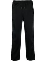 Saint Laurent pantalon de jogging rayé à logo brodé - Noir