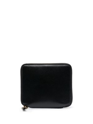 Comme Des Garçons Wallet portefeuille en cuir à slogan imprimé - Noir Comme Des Garçons Wallet portefeuille en cuir à slogan imprimé - Noir