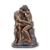 A BRONZE SCULPTURE CALLED "THE LOVERS" ON A MARBLE BASE