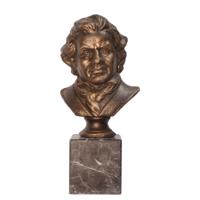 A CAST IRON BUST OF LUDWIG VON BEETHOVEN ON MARBLE BASE A CAST IRON BUST OF LUDWIG VON BEETHOVEN ON MARBLE BASE