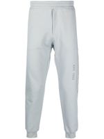 Alexander McQueen pantalon de jogging en coton à logo imprimé - Gris - thumbnail