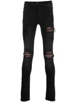 AMIRI jean skinny à effet usé - Noir