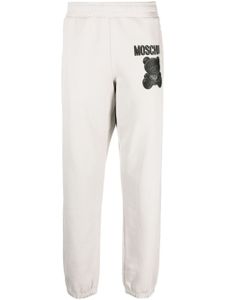 Moschino pantalon de jogging en coton biologique à imprimé Teddy Bear - Gris