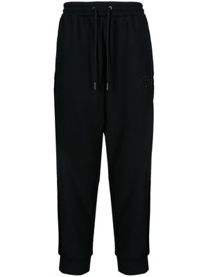 Giorgio Armani pantalon de jogging fuselé à logo brodé - Noir