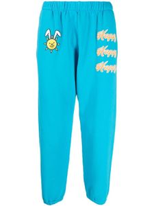 Natasha Zinko pantalon de jogging à imprimé Happy - Bleu