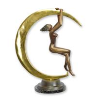 A BRONZE SCULPTURE OF A FEMALE NUDE AND CRESCENT MOON A BRONZE SCULPTURE OF A FEMALE NUDE AND CRESCENT MOON