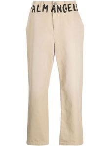 Palm Angels pantalon chino à logo imprimé - Tons neutres