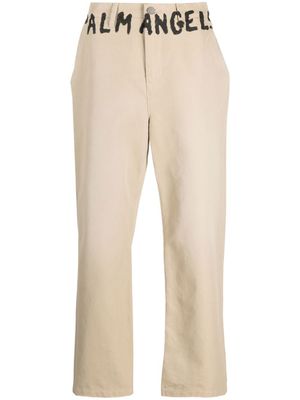 Palm Angels pantalon chino à logo imprimé - Tons neutres