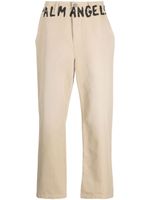 Palm Angels pantalon chino à logo imprimé - Tons neutres