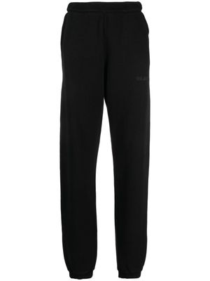 The Attico pantalon de jogging en coton à logo embossé - Noir