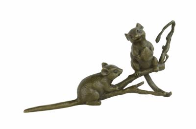 A BRONZE SCULPTURE OF TWO MICE ON A BRANCH