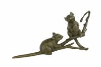 A BRONZE SCULPTURE OF TWO MICE ON A BRANCH