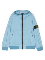 Stone Island Junior imperméable à capuche - Bleu