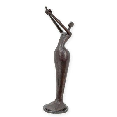 A MODERNIST BRONZE SCULPTURE OF A WOMAN HOLDIGN A BIRD