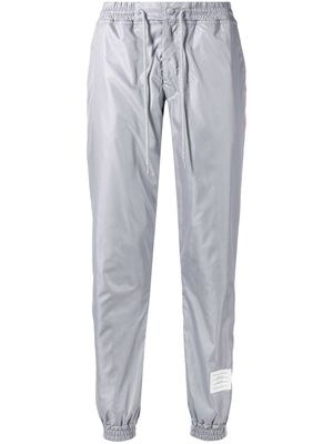 Thom Browne pantalon de jogging à détail rayé - Gris
