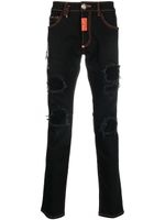 Philipp Plein jean slim à finitions effilochées - Noir