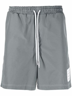 Thom Browne short de sport à taille à lien de resserrage - Gris
