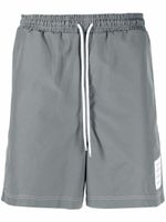 Thom Browne short de sport à taille à lien de resserrage - Gris Thom Browne short de sport à taille à lien de resserrage - Gris