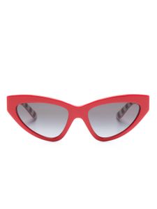 Dolce & Gabbana Eyewear lunettes de soleil Crossed à monture papillon - Rouge