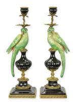 A PAIR OF BRONZE MOUNTED PORCELAIN PARROT CANDLE HOLDERS