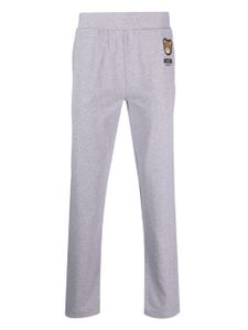 Moschino pantalon de jogging à imprimé Leo Teddy - Gris