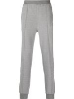 Corneliani pantalon de jogging fuselé à patch logo - Gris