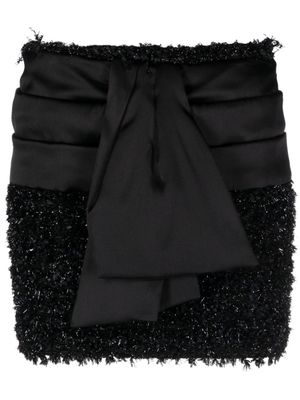 Balmain minijupe en tweed à design noué - Noir