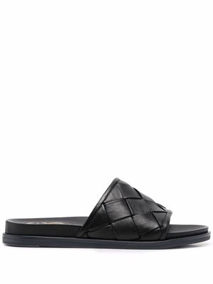 Casadei claquettes en cuir tressé - Noir