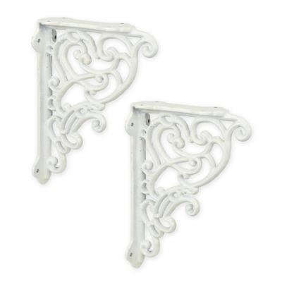 A PAIR OF CAST IRON WALL BRACKETS