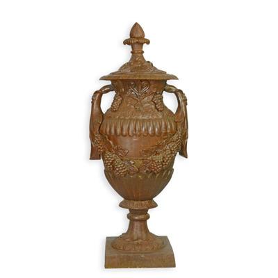 A CAST IRON ORNAMENTAL GARDEN URN ON STAND, RUST LOOK