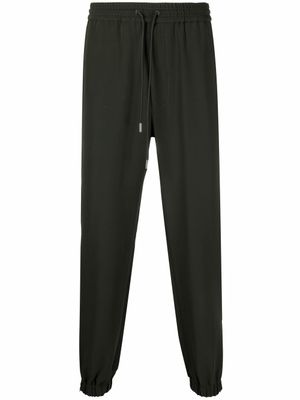 Alexander McQueen pantalon de jogging à lien de resserrage - Vert