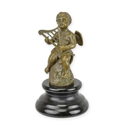 A BRONZE SCULPTURE OF AN ANGEL