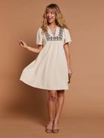 Jurk van katoengaas met geborduurde details zandbeige