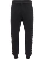 Alexander McQueen eyelet-detail track pants - Noir - thumbnail