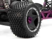 Dirt buster block tire s compound on black wheel