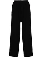 Undercover pantalon de jogging en laine à coupe ample - Noir Undercover pantalon de jogging en laine à coupe ample - Noir