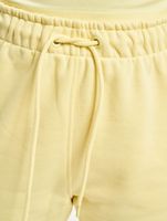 Karl Kani / joggingbroek Signature in geel - thumbnail