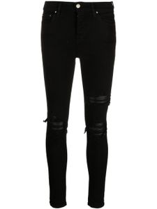 AMIRI jean skinny à effet usé - Noir