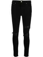AMIRI jean skinny à effet usé - Noir